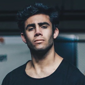 Headshot of a man in a black t-shirt.
